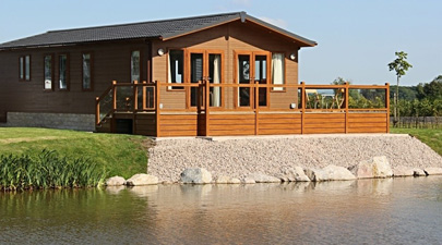 AB Sundecks Picket Glass on raised decking on water over looking the lake